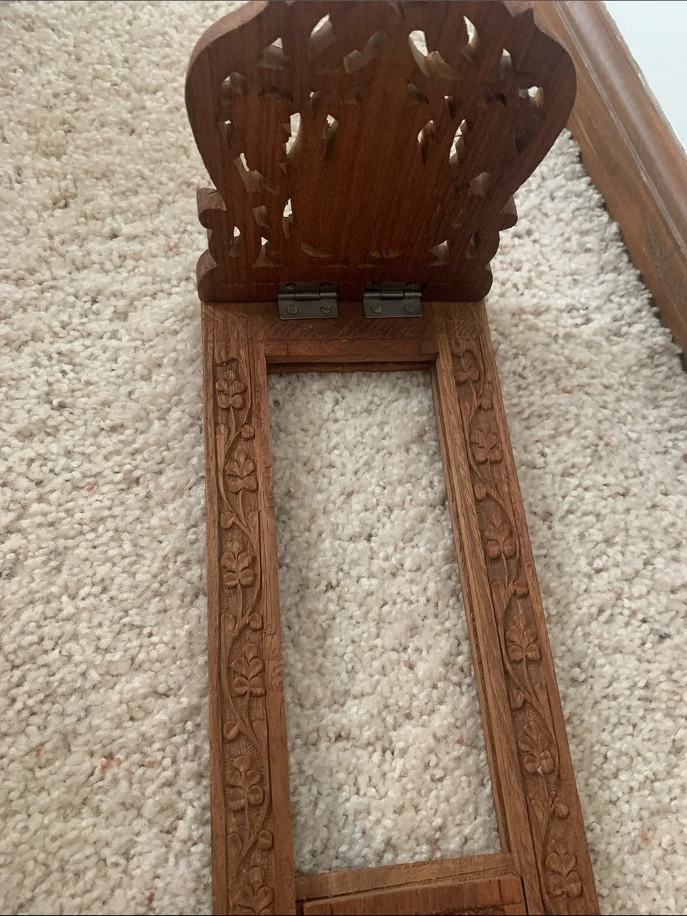 Vintage hand carved expanding book rack.